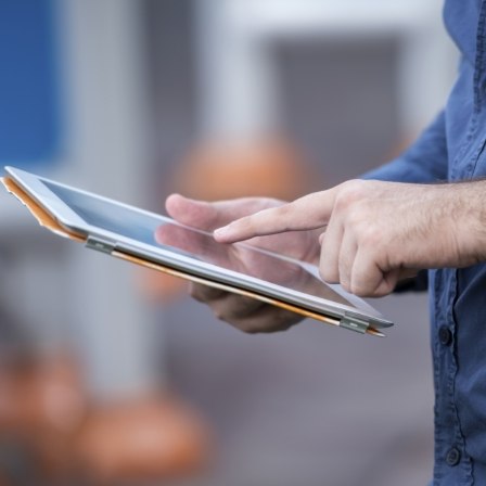 Person touching a tablet screen