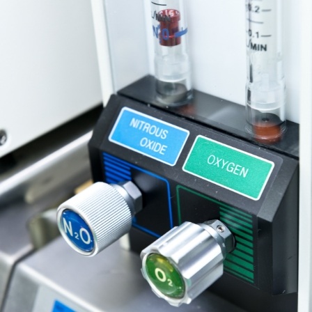 Machine in dental office with one button labeled nitrous oxide and another labeled oxygen